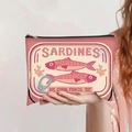 Detail of pink vintage sardines canvas bag with zipper held by hand for storage - Pink Sardines Style