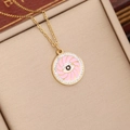Gouden evil eye ketting met roze emaille en kristallen in een beige geschenkdoosje - Roze