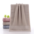 Absorbent pure cotton towel in light coffee brown with decorative woven wave border - Vine Pattern Khaki / 34*74cm
