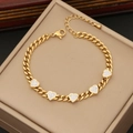 Elegant gold heart pendant necklace with shimmering crystals on a jewelry box cushion - 2# Bracelet
