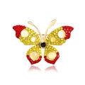 Golden butterfly brooch with red and yellow rhinestones and white opal accents - Red Yellow Gradient