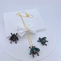 Detail of gold necklace and beetle earrings set with green cubic zirconia on white stand - Necklace and Earring Set / Dark Grey Green Rhinestone Beetle Set