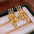 Macro shot of gold tassel earrings with layered leaf details on elegant silk background - Gold Wheat Ear Tassel Dangle Earrings (925 Silver Pin)
