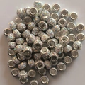Close-up of sparkling multicolor crystal large hole beads for DIY jewelry making - AB Color