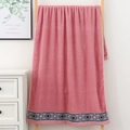 Pink cotton bath towel with geometric diamond fringe hanging on a wooden ladder - Geometric Ethnic Pattern Hand Towel (Dusty Pink) / 34*74cm