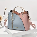 Fashion contrast color handbag with blue and pink panels and golden heart charm - Blue and Pink