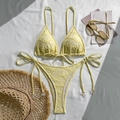Detail of light yellow textured bikini with halter ties and pearl bead accents - Yellow