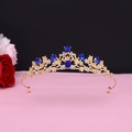 Detail of baroque gold crown with blue crystal gems and white diamonds on black background - No.12 KC Gold (Royal Blue Stone)