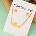 Detailed view of gold stainless steel necklace and butterfly heartbeat earrings set - Branch Butterfly Set