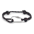 Detail of multi-color braided rope bracelet with a silver carabiner and sliding knot - No. 14 Black Red & White Woven