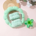 Detail of mint green sponge headband and matching wristbands set for face washing - Cyan Headband Wristbands And Plumeria Clip