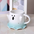 Macro detail of ghost ceramic mug featuring black facial expressions and grey stars - 16oz / Large Blue Gradient Ghost Mug (With Spoon)