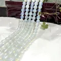 Translucent white round beads strand with opal luster on a white ceramic plate - 6mm / Approx 63pcs / Opalite