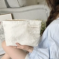 Floral jacquard white vanity bag with vintage textures held in a home setting - White Sketch Flower