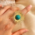 Bohemian gold sunburst ring with round turquoise gemstone on a marble background - Round Turquoise Sunburst Style / Gold
