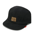 Detailed close-up of a black five-panel nylon outdoor cap with a brown logo patch - M (56-58cm) / Black