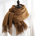 Caramel brown cashmere feel tassel scarf for women styled on white knitted top - Brown