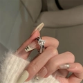 S925 sterling silver bow ring with shimmering zircon stones on a model finger - Silver Geometric Knot Rhinestone Ring (J3775)