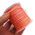 Detailed macro view of pink yellow and orange braided cord on a transparent plastic spool - Approx. 2.0mm / Pink, Yellow and Orange