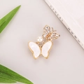 Elegant gold butterfly brooch with white wings, crystals and a central pearl accent - Xd825302