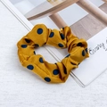 Mustard yellow oversized scrunchie with navy blue polka dots in a silk satin finish - Yellow