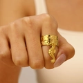 Close-up of a gold starfish ring on finger with detailed seahorse pendant and hammered metal - Seahorse Style (11971)
