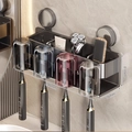Dark grey wall-mounted suction toothbrush holder with 4 cups and electric brush slots - Family of 4 · 4 Colored Cups