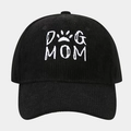 Detailansicht der schwarzen Cord-Basecap mit weißer DOG MOM Stickerei und Textur - Schwarz