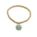 Détail du bracelet à billes dorées avec pendentif marguerite turquoise et zircon central - Vert