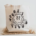 Cream canvas tote bag featuring spooky vibes halloween print and vintage graphic - Spooky Vibes Twisted Fluid Smiley