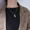 Silver dual pendant necklace with engraved French tag and hollow ring on a model - Couple Necklace Women - Ocean Oath