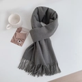 Detailed view of grey cashmere-feel scarf with elegant fringes on a minimalist desk - Regular Fit / Dark Gray