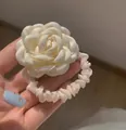 Elegant off-white satin camellia flower hair scrunchie with layered fabric petals - Cream Camellia Hair Tie (25)
