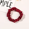Macro detail of wine red satin scrunchie with silky pleated texture and elastic core - Satin Thin Scrunchie-Wine Red
