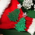 Macro shot of green glitter Christmas tree earrings with star charm on red background - Green Glitter Christmas Tree Star Ear Hook