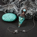 Macro view of a conical crystal resin pendant with copper filigree and turquoise beads - Antique Bronze Turquoise