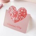 Detail of pink Valentine's Day card holder with heart-shaped confetti and elegant typography - Candy Heart