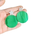 Detail of green acrylic earrings with silver glitter star and textured grid pattern - Green