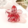 Detailed view of pink gradient flower hair claw clip with transparent acrylic texture - Transparent Red
