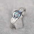 Minimalist geometric ring with marquise-cut blue gemstone in a sleek bezel setting - US 7 / White Gold