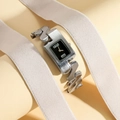 Minimalist silver chain watch with rectangular black dial and gold hands on display - Silver Case Black Dial Women