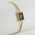 Golden box chain bracelet featuring a black enamel rectangular pendant with letter F detail - F-Black