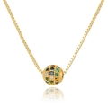 Macro shot of a golden box chain with a round pendant inlaid with colorful zircon stones - Colorful