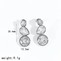 Detail view of 28.4mm drop earrings featuring three graduated cubic zirconia stones - Wave Triple Stone Style / Silver (TE60458-S)
