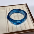 Elegant blue marble resin bangle with smoke patterns presented in a jewelry box - Geometric Rhombus / Inner Diameter 65mm / Ocean Blue
