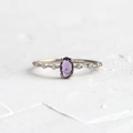 Elegant 18k gold plated ring with oval purple zircon and sparkling side stones - US 6 / Silver