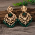 Vintage bohemian earrings in golden hollow design with green beads and bell charms - Green