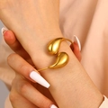 Polished gold teardrop open bangle bracelet in chunky minimalist stainless steel design - Double Water Drop Design (8813)