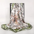 90cm green butterfly and floral print satin square scarf displayed on a minimalist metal rack - White Green Border Butterfly Plant (4)