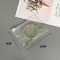 Detail of a 9x13cm clear PVC zipper bag for jewelry storage with a gold bangle inside - 25 Microns 13*9cm (100 Pcs)